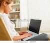 stock-photo-busy-young-woman-sitting-on-a-chair-and-working-on-a-computer-laptop-in-her-house-24.jpg