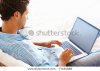 stock-photo-man-sitting-on-sofa-and-working-on-his-laptop-77181688.jpg