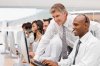 istockphoto_7007989-happy-businesspeople-working-on-laptop.jpg