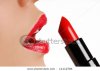 stock-photo-woman-applying-lipstick-bright-color-11112784.jpg