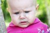1490316-little-baby-girl-outdoors-looking-down.jpg
