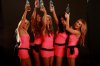 ibiza shot girls holding bottles in the air.jpg